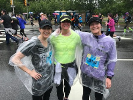 UTRS employee participating in Philadelphia Broad Street Run and getting support from fellow employees.