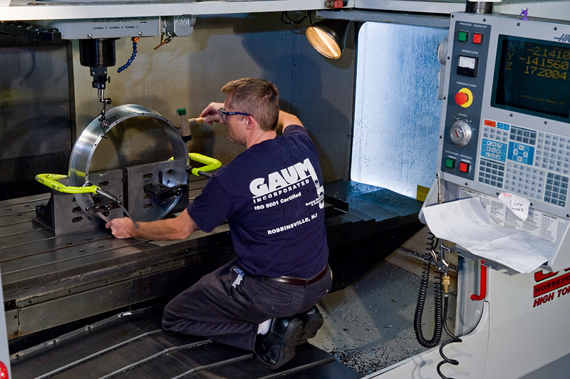 UTRS AM technician using a large part milling and turning machine