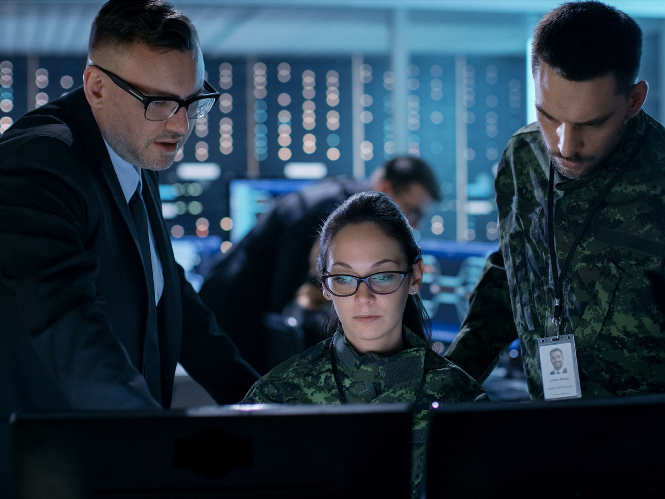 Government Surveillance Agency and Military Joint Operation. Male Agent, Female and Male Military Officers Working at System Control Center.