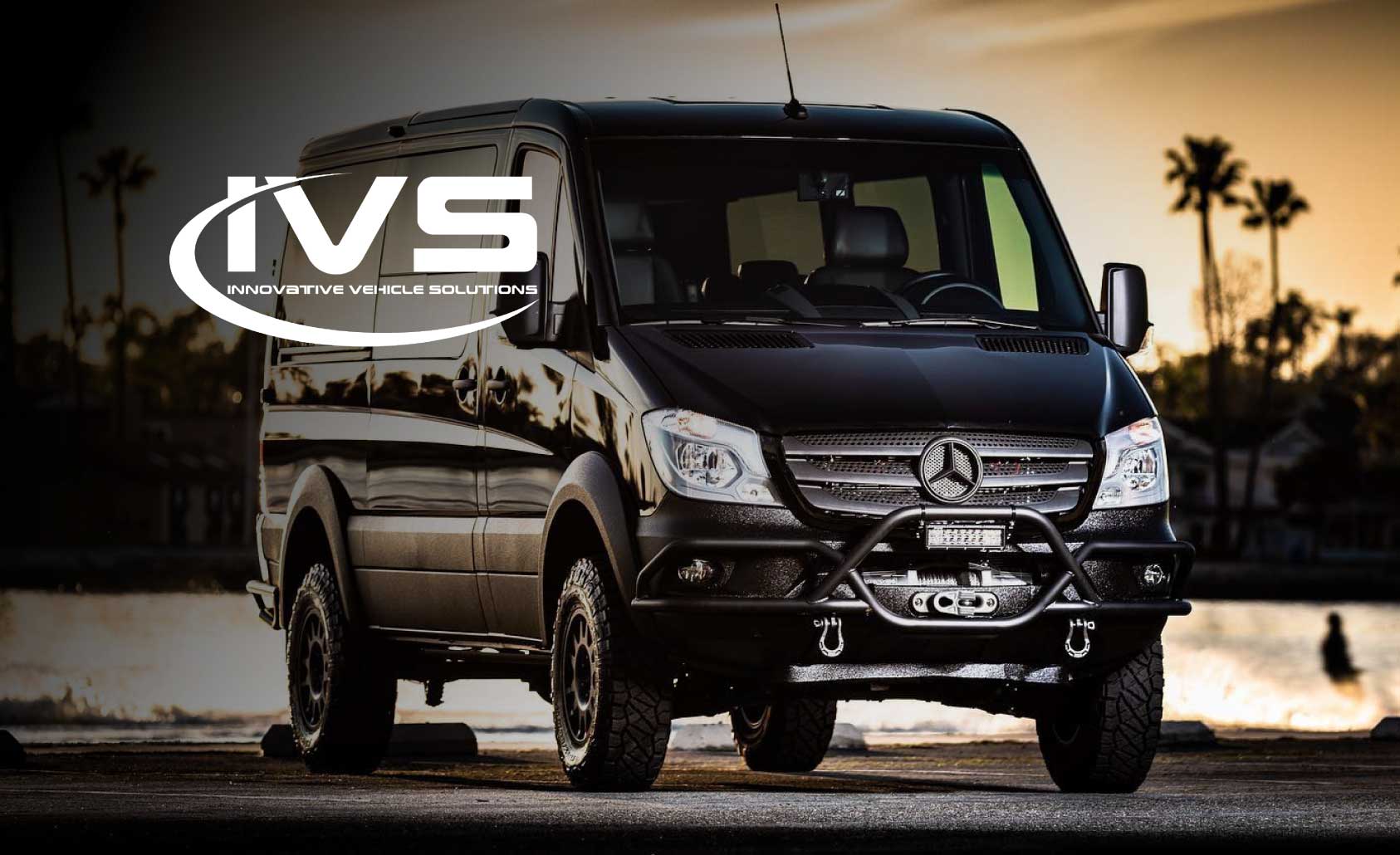 Photo of all black, customized Mercedes Benz Sprinter panel van with logo of IVS Innovative Vehicle Solutions overlaid.