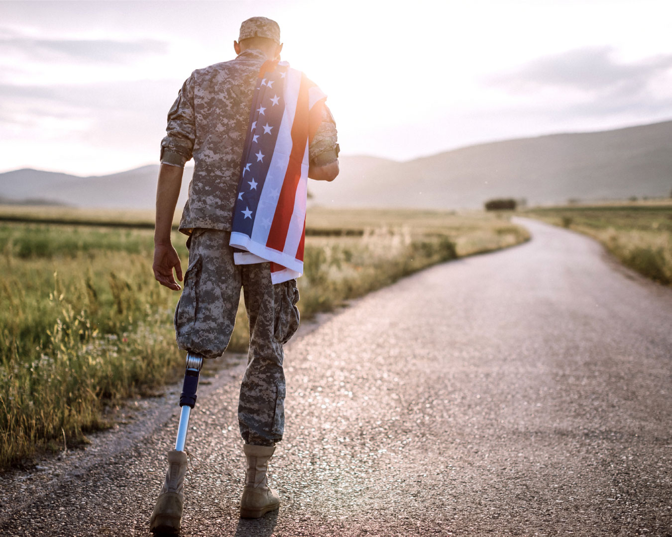 American Amputee Soldier On Road.