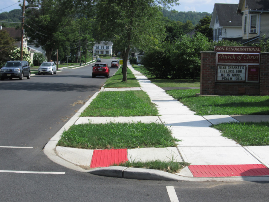 Grand Ave Sidewalk & Curbing - West Stewart Street corner