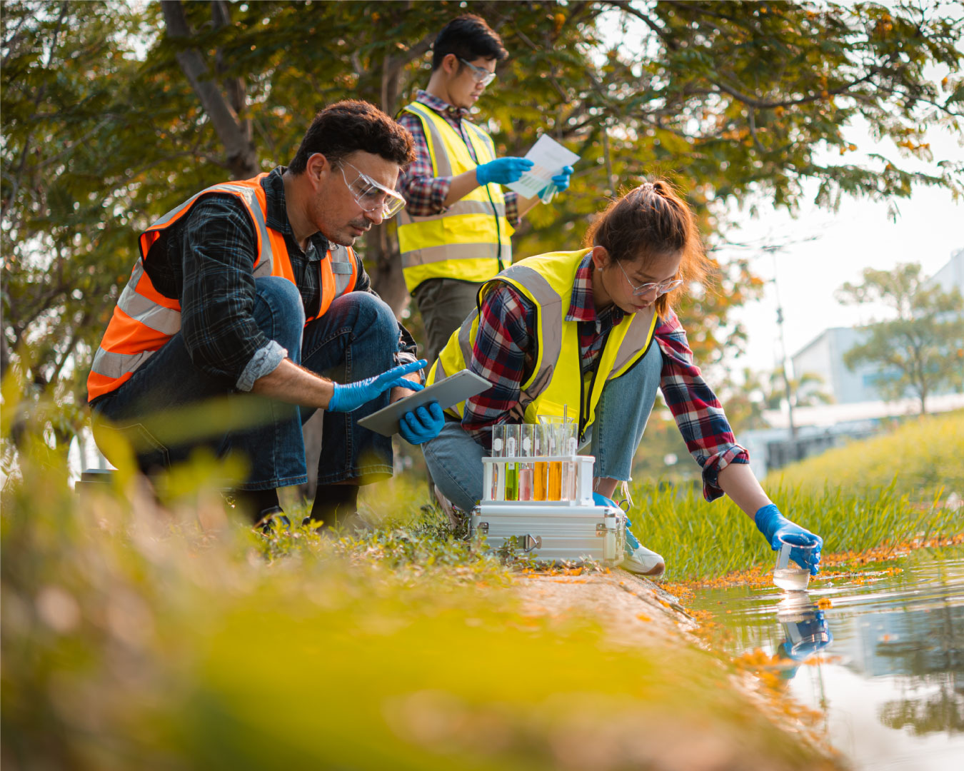 Scientists team collect water samples for analysis and research on water quality, environment